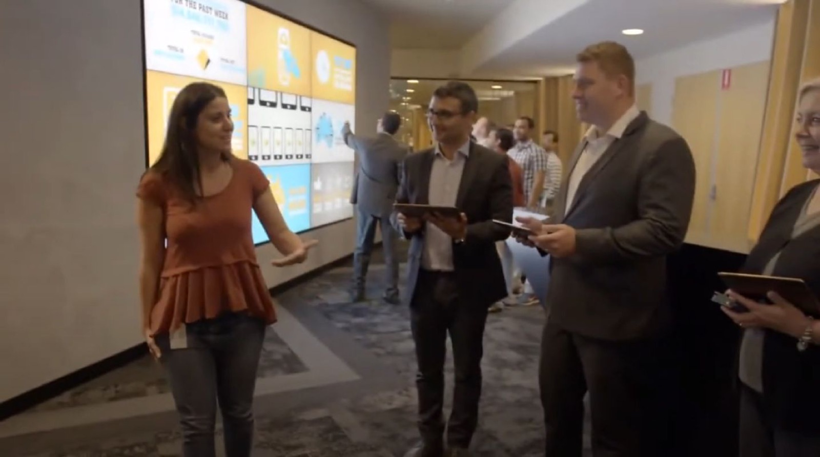 Visitors at an interactive wall in the CBA Innovation Lab
