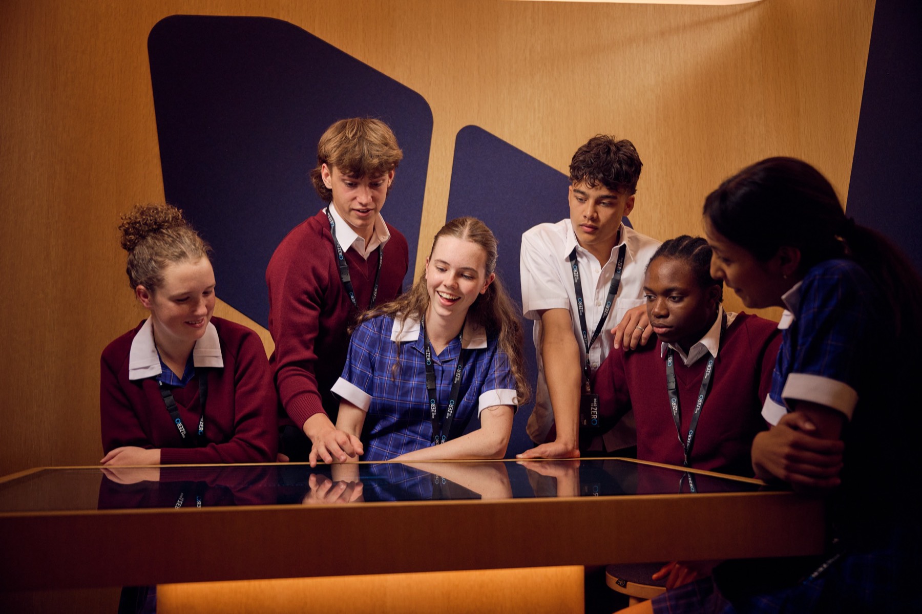 Students gathered around a Create Space touch pod