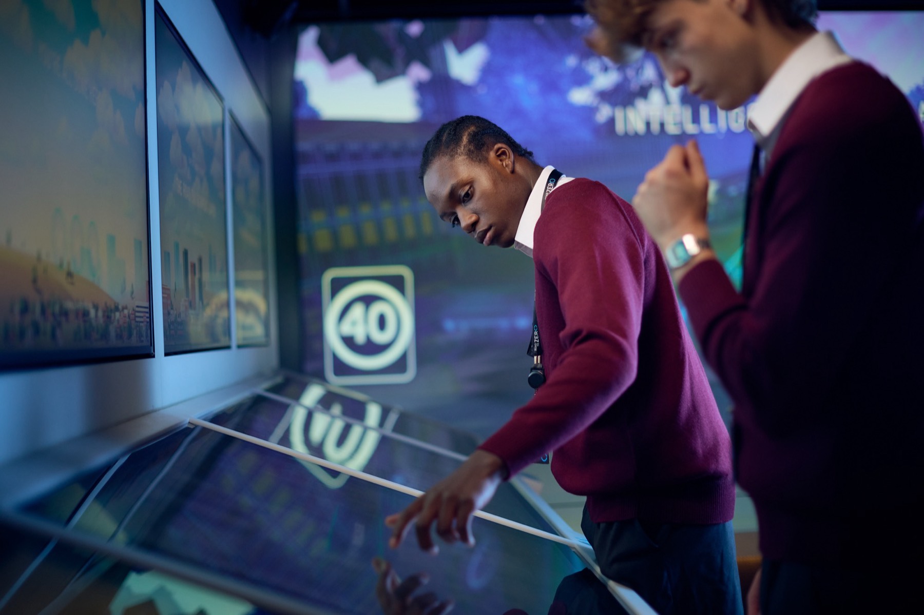 A student exploring speed zones on a touch table
